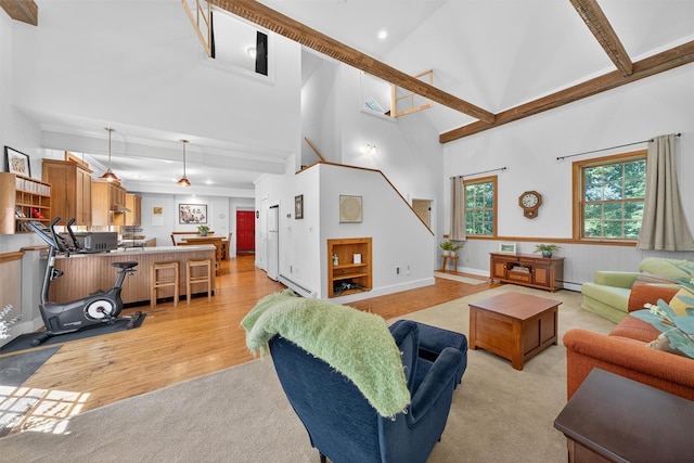 62 Guymard Tpke, Godeffroy, NY 12729 - living area with high vaulted ceiling, light wood-style flooring, a baseboard radiator, and recessed lighting