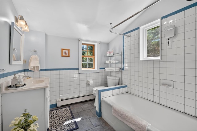 62 Guymard Tpke, Godeffroy, NY 12729 - full bathroom featuring a baseboard radiator, vanity, tile walls, stone finish flooring, and shower / tub combination