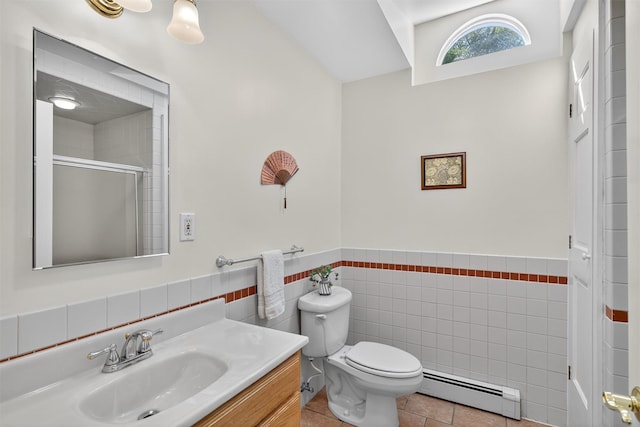 62 Guymard Tpke, Godeffroy, NY 12729 - bathroom with a baseboard heating unit, vanity, a shower with shower door, tile patterned floors, and wainscoting