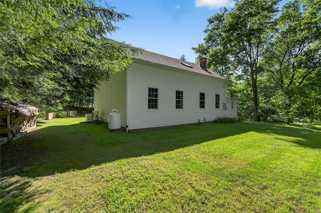 62 Guymard Tpke, Godeffroy, NY 12729 - rear view of house featuring a chimney and a yard