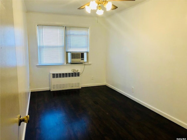 5-39 117th St, Flushing, NY 11356 - spare room with radiator, ceiling fan, cooling unit, dark wood-style floors, and crown molding