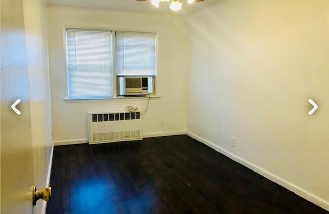 5-39 117th St, Flushing, NY 11356 - spare room featuring radiator, cooling unit, a ceiling fan, and dark wood-style flooring