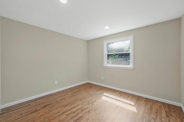 12 Bay Ave, Lake Ronkonkoma, NY 11779 - unfurnished room featuring wood finished floors and recessed lighting