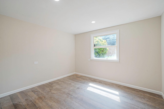 12 Bay Ave, Lake Ronkonkoma, NY 11779 - unfurnished room featuring wood finished floors and recessed lighting