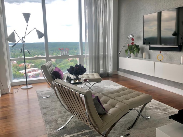 5 Renaissance Sq Unit Ph6C, White Plains, NY 10601 - living room featuring wood finished floors, healthy amount of natural light, and a textured wall