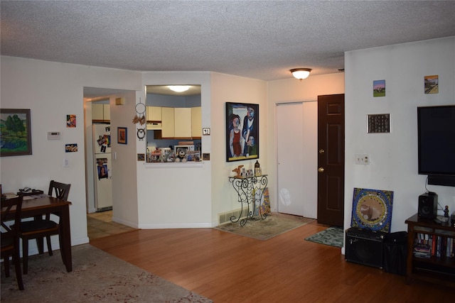 3905 Wild Berry Ct Unit 6C, Poughkeepsie, NY 12603 - living room with wood finished floors and a textured ceiling
