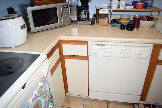 3905 Wild Berry Ct Unit 6C, Poughkeepsie, NY 12603 - kitchen featuring dishwasher, stainless steel microwave, light countertops, and white cabinets