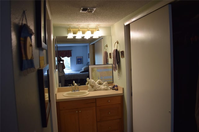 3905 Wild Berry Ct Unit 6C, Poughkeepsie, NY 12603 - ensuite bathroom with a textured ceiling and vanity