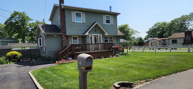 76 Gooseberry Rd, Mastic Beach, NY 11951 - view of front of property featuring a wooden deck and a chimney