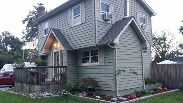 76 Gooseberry Rd, Mastic Beach, NY 11951 - view of side of property featuring a chimney, a deck, cooling unit, and roof with shingles