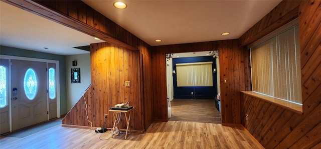 76 Gooseberry Rd, Mastic Beach, NY 11951 - entryway with light wood-type flooring, wooden walls, and recessed lighting
