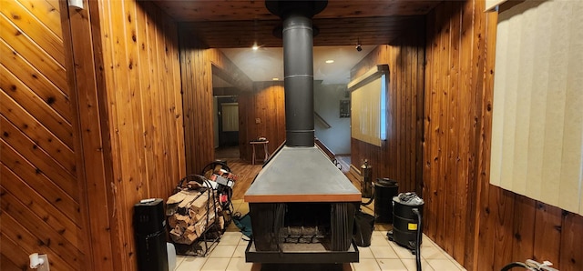 76 Gooseberry Rd, Mastic Beach, NY 11951 - misc room featuring a wood stove, wooden walls, tile patterned flooring, and wainscoting