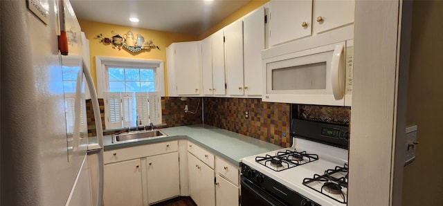 76 Gooseberry Rd, Mastic Beach, NY 11951 - kitchen featuring white appliances, decorative backsplash, light countertops, white cabinetry, and recessed lighting