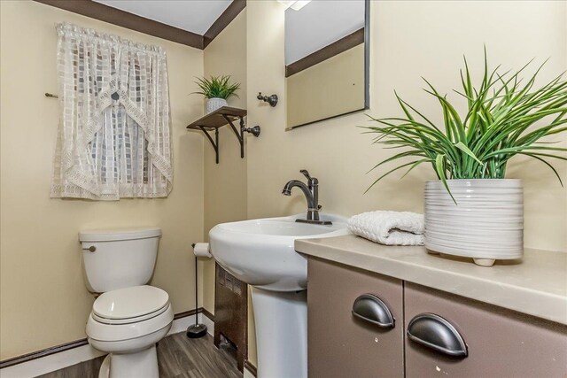 165 Wheeler Ave, Valley Stream, NY 11580 - half bathroom featuring wood finished floors and toilet