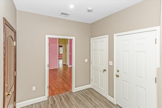 165 Wheeler Ave, Valley Stream, NY 11580 - foyer entrance with light wood-type flooring and recessed lighting