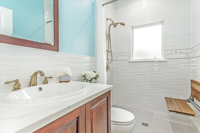 165 Wheeler Ave, Valley Stream, NY 11580 - bathroom with vanity, a shower, tile walls, tile patterned flooring, and a wainscoted wall