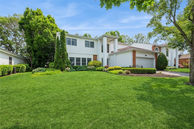 166 Country Club Dr Unit 166, Commack, NY 11725 - greek revival inspired property featuring an attached garage, a front yard, brick siding, and concrete driveway