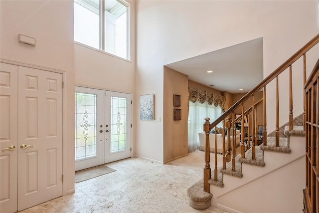 166 Country Club Dr Unit 166, Commack, NY 11725 - entryway featuring french doors, a towering ceiling, and stairway