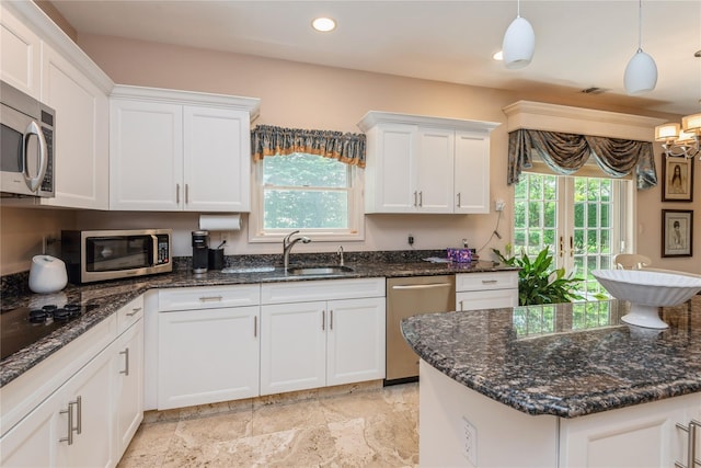 166 Country Club Dr Unit 166, Commack, NY 11725 - kitchen with stainless steel appliances, white cabinetry, healthy amount of natural light, dark stone counters, and recessed lighting