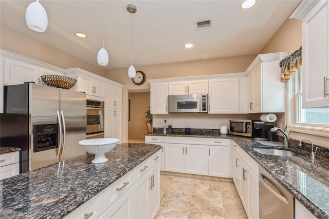 166 Country Club Dr Unit 166, Commack, NY 11725 - kitchen featuring stainless steel appliances, white cabinetry, decorative light fixtures, recessed lighting, and dark stone counters