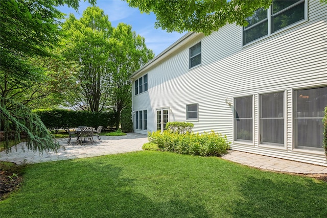 166 Country Club Dr Unit 166, Commack, NY 11725 - rear view of house featuring a yard and a patio