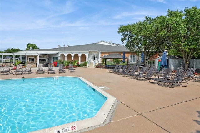 166 Country Club Dr Unit 166, Commack, NY 11725 - community pool featuring a patio area