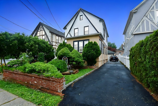 517 Westchester Ave, Mount Vernon, NY 10552 - tudor-style house featuring stucco siding