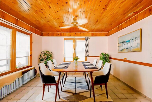 517 Westchester Ave, Mount Vernon, NY 10552 - tiled dining room with radiator, ceiling fan, and wood ceiling