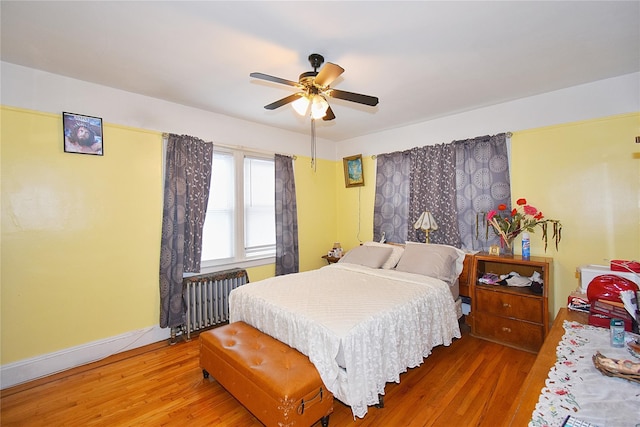 517 Westchester Ave, Mount Vernon, NY 10552 - bedroom featuring radiator heating unit, wood finished floors, and ceiling fan