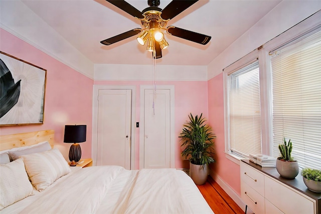 517 Westchester Ave, Mount Vernon, NY 10552 - bedroom with light wood finished floors and a ceiling fan