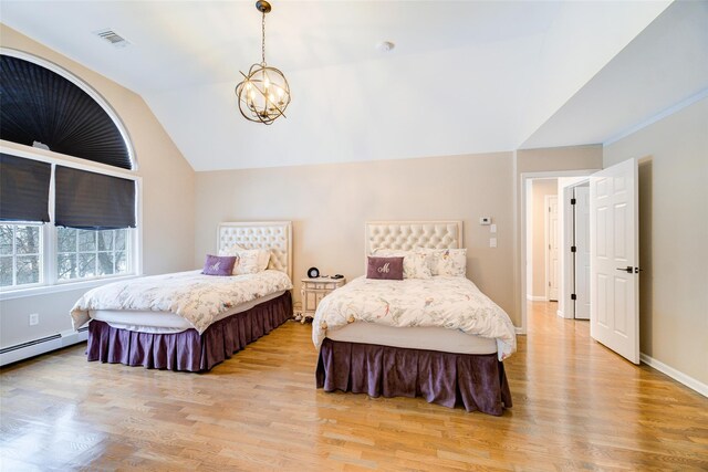 83 N Airmont Rd, Suffern, NY 10901 - bedroom featuring a chandelier, vaulted ceiling, light wood-style floors, and a baseboard heating unit