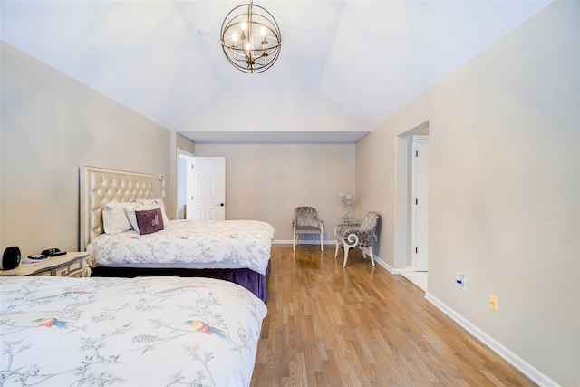 83 N Airmont Rd, Suffern, NY 10901 - bedroom featuring light wood-style floors, a chandelier, and vaulted ceiling