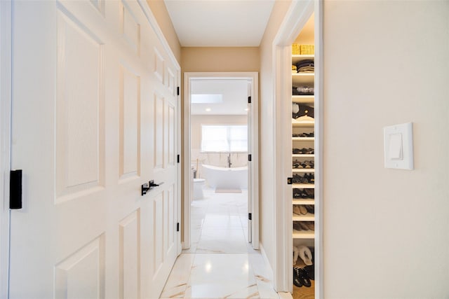 83 N Airmont Rd, Suffern, NY 10901 - corridor with light marble finish floors
