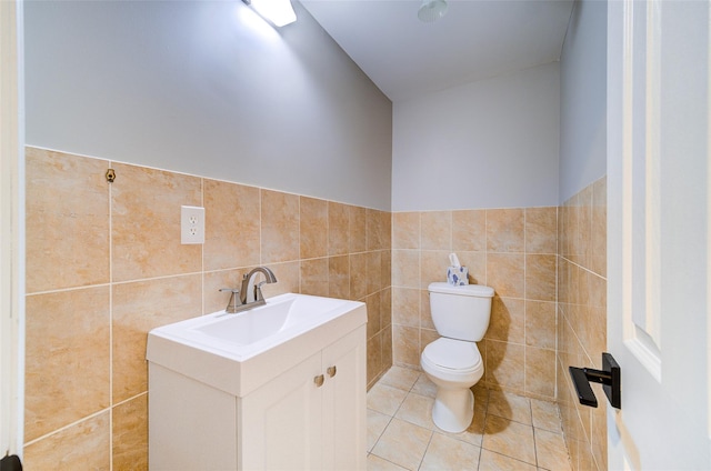 83 N Airmont Rd, Suffern, NY 10901 - bathroom featuring vanity, tile walls, tile patterned flooring, and a wainscoted wall