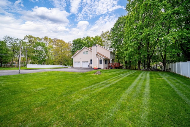 83 N Airmont Rd, Suffern, NY 10901 - view of yard with asphalt driveway and an attached garage