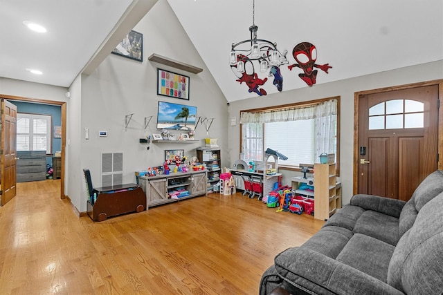 9 Schnabl Ct, Wappingers Falls, NY 12590 - living area featuring light wood-type flooring, plenty of natural light, high vaulted ceiling, and recessed lighting