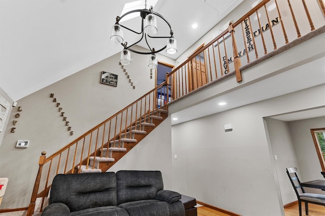 9 Schnabl Ct, Wappingers Falls, NY 12590 - stairway featuring wood finished floors, a towering ceiling, and recessed lighting