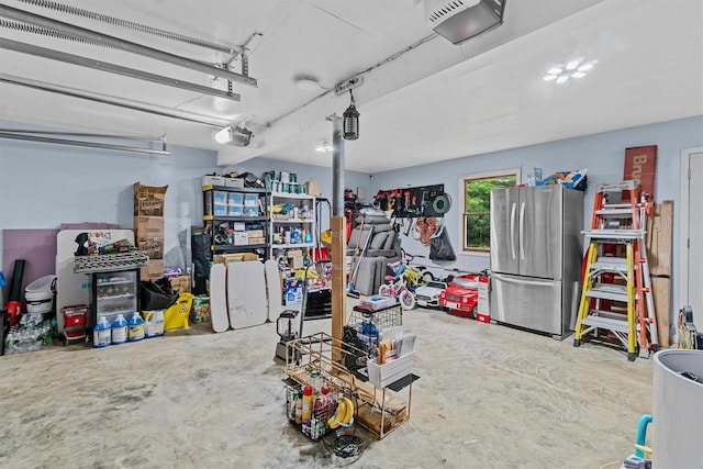 9 Schnabl Ct, Wappingers Falls, NY 12590 - garage featuring freestanding refrigerator and a garage door opener