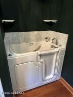 138 Lydon Ln, Hannacroix, NY 12124 - laundry view of wood finished floors and baseboards