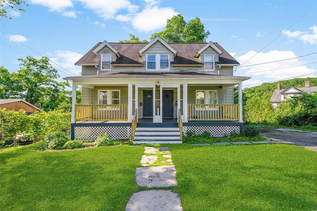 5 Putnam Ter, Brewster, NY 10509 - view of front facade featuring a front yard, a porch, and roof with shingles