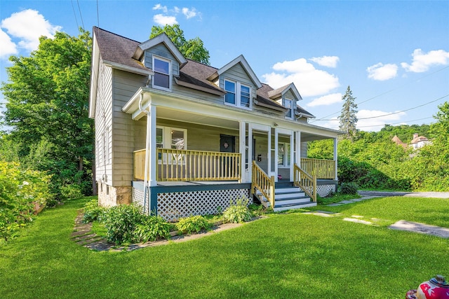 5 Putnam Ter, Brewster, NY 10509 - cape cod house with covered porch, a front lawn, and a shingled roof