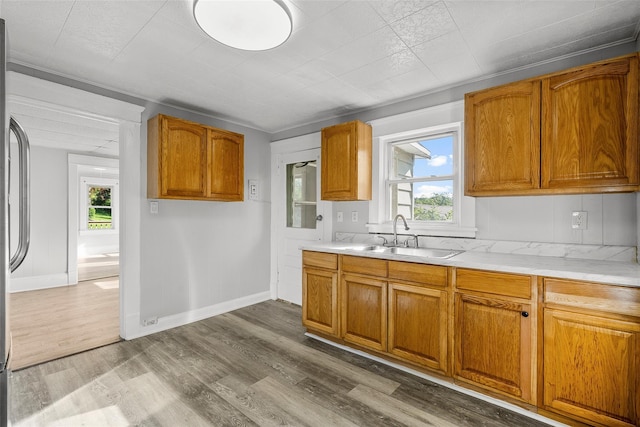 5 Putnam Ter, Brewster, NY 10509 - kitchen with dark wood-type flooring, light countertops, healthy amount of natural light, and brown cabinets