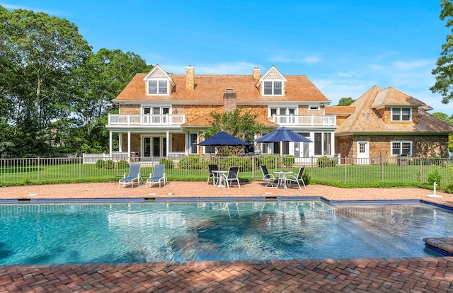 1 Simon Ct, Quogue, NY 11959 - view of swimming pool with a patio and french doors