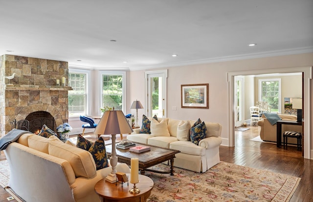 1 Simon Ct, Quogue, NY 11959 - living area featuring ornamental molding, healthy amount of natural light, wood finished floors, a fireplace, and recessed lighting