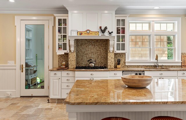 1 Simon Ct, Quogue, NY 11959 - kitchen featuring gas stovetop, ornamental molding, white cabinets, light stone countertops, and stainless steel dishwasher