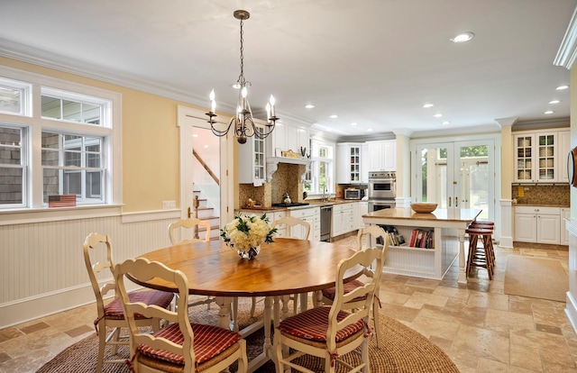 1 Simon Ct, Quogue, NY 11959 - dining space with stone tile flooring, stairway, a chandelier, ornamental molding, and recessed lighting