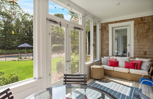 1 Simon Ct, Quogue, NY 11959 - sunroom / solarium featuring outdoor dining area, an outdoor hangout area, and french doors