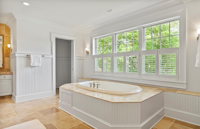1 Simon Ct, Quogue, NY 11959 - bathroom with a garden tub, wainscoting, ornamental molding, a decorative wall, and vanity