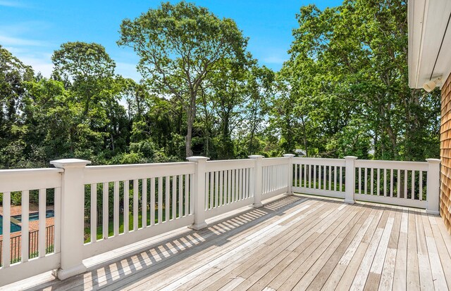 1 Simon Ct, Quogue, NY 11959 - wooden deck with view of wooded area