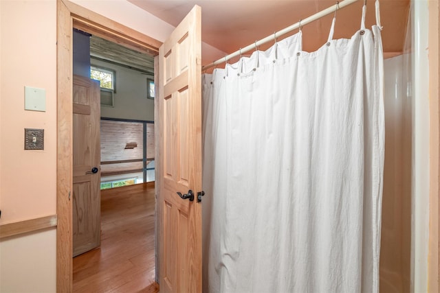 30 Hallenbach Rd, Glen Spey, NY 12737 - bathroom with wood finished floors and a shower with shower curtain